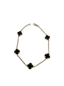Bracelet en or 10K avec petits trèfles en  noir