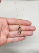 Collier croix infini en or 10 carats